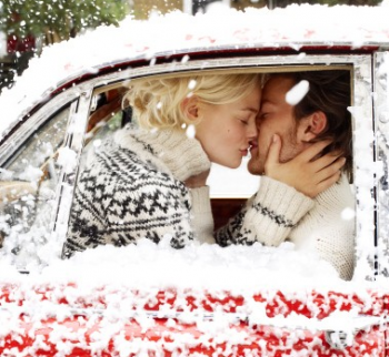 snow kiss in red car winter wedding