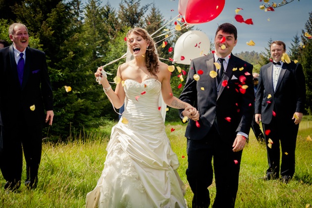 bride carrying balloons